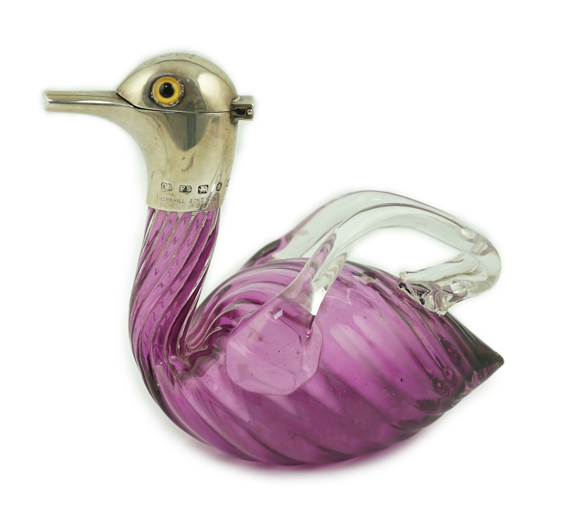 A late Victorian novelty silver mounted amethyst coloured glass liqueur jug, modelled as a duck, by Saunders & Shepherd, retailed by Thornhill